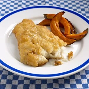 Fried fish with pumpkin chips, close-up