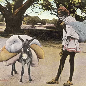 Man and his donkey (colour photo)