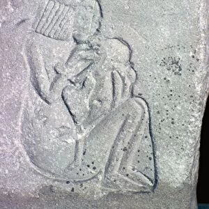 Egyptian relief of a woman suckling a child, 14th century BC