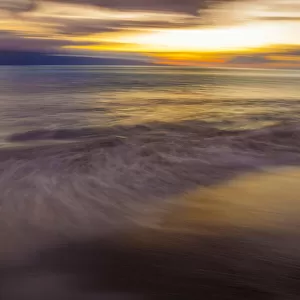An intentionally / artistically blurred sunset from the island of Maui, Hawaii, USA; Maui, Hawaii, United States of America