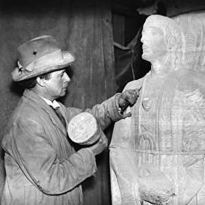 A sculptor working on a sculpture of an angel for the Anglican Cathedral in Liverpool