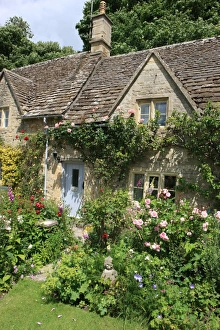 <b class=qtipBold><figcaption>Cottage Garden</figcaption></b><br>The garden of a cotswold cottage in the village of Bibury on a summers day with all its colour Bibury Gloucestershire England Great Britain UK<br><em>© Paul Felix Photography Twelve Beacon Park Pelynt nr Looe Cornwall PL13 2PQ photos@paulfelix.co.uk 01503 221069</em> Cottage Garden