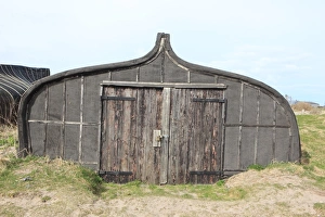 <b class=qtipBold><figcaption>Holy Island</figcaption></b><br>An old fishing boat now used as a shed by the fisherman on Holy Island<br><em>© Paul Felix Photography Twelve Beacon Park Pelynt nr Looe Cornwall PL13 2PQ photos@paulfelix.co.uk 01503 221069</em> Holy Island
