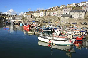 <b class=qtipBold><figcaption>Mevagissey</figcaption></b><br>Small Fishing Boats on a winters day in the harbour at Mevagissey on the South Coast of Cornwall, very popular with holiday makers in the summer. Now all the visitors have gone but the fishing goes all year-round.<br><em>© Paul Felix Photography Twelve Beacon Park Pelynt nr Looe Cornwall PL13 2PQ photos@paulfelix.co.uk 01503 221069</em> Mevagissey