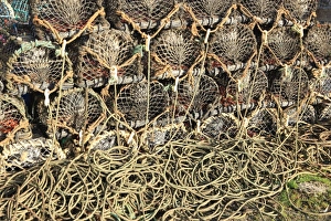 <b class=qtipBold><figcaption>Rope and Potes</figcaption></b><br>Lobster Pots and ropes on the Quayside in the Cornish fishing port of Charlestown on the south coast<br><em>© Paul Felix Photography Twelve Beacon Park Pelynt nr Looe Cornwall PL13 2PQ photos@paulfelix.co.uk 01503 221069</em> Rope and Potes