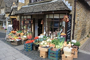 <b class=qtipBold><figcaption>The Shop</figcaption></b><br>Fresh vegetables on display outside a shop in the Cotswold village of Broadway.<br><em>© Paul Felix Photography Twelve Beacon Park Pelynt nr Looe Cornwall PL13 2PQ England</em> The Shop
