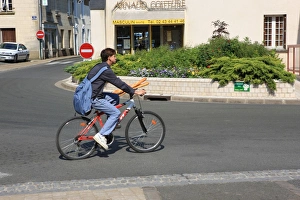 <b class=qtipBold><figcaption>Shopping in France</figcaption></b><br>, A boy on a bike shopping for bread in the French town of La Chartre Sur-La-Loir<br><em>© Paul Felix Photography Twelve Beacon Park Pelynt nr Looe Cornwall PL13 2PQ photos@paulfelix.co.uk 01503 221069</em> Shopping in France