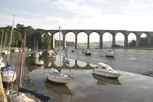 <b class=qtipBold><figcaption>St Germans</figcaption></b><br>Early morning at low tide on the river below the rail Viaduct at St Germans in Cornwall with its quayside and boats<br><em>© Paul Felix Photography Twelve Beacon Park Pelynt nr Looe Cornwall PL13 2PQ photos@paulfelix.co.uk 01503 221069</em> St Germans