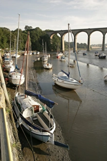 <b class=qtipBold><figcaption>St Germans</figcaption></b><br>Early morning at low tide on the river below the rail Viaduct at St Germans in Cornwall with its quayside and boats<br><em>© Paul Felix Photography Twelve Beacon Park Pelynt nr Looe Cornwall PL13 2PQ photos@paulfelix.co.uk 01503 221069</em> St Germans