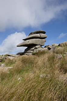 <b class=qtipBold><figcaption>Windswept stones on Bodmin Moor</figcaption></b><br>A Windswept stones shaped by the wind over years, high on Bodmin Moor below the Cheesewring a granite tor on the eastern flank of the Moor at Stowe's Hill near Minions. Bodmin Moor has many Tor's, the Chessewring is one of the largest and most visited. A local legend says that the Cheesewring is the result of a contest between a man and a giant. When Christianity had just been introduced to the British Islands. The granite slabs formed by weathering. The name derives from the resemblance of the piled slabs to a cheesewring, a press used to make cheese.<br><em>© Paul Felix Photography Twelve Beacon Park Pelynt nr Looe Cornwall PL13 2PQ</em> Windswept stones on Bodmin Moor